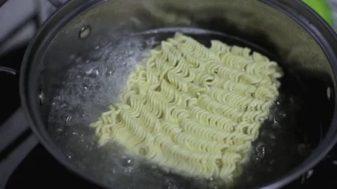 Cooking instant noodles by boiling Stock Footage 208655063