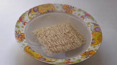 Cooking instant vermicelli. Accelerated shooting. Stock Footage 201804723