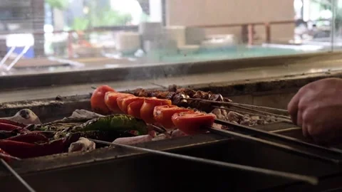 Cooking kebab in front of grill 動画素材 164118609