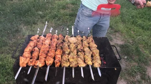 Cooking kebabs on the grill Stock Footage 110799138