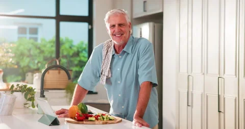 Cooking, kitchen and face of mature man with smile ready for dinner, supper and Stock Footage 318721221