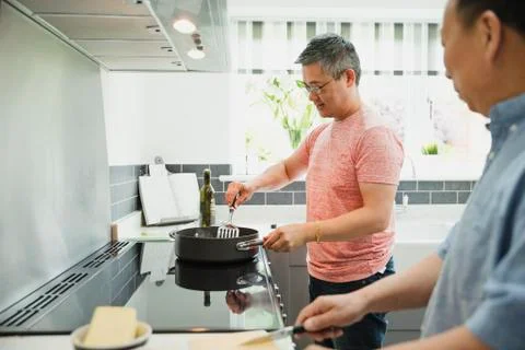 Cooking in the Kitchen with Dad Fotos Stock