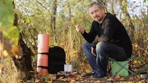 Cooking by the lake Stock Footage 97106674