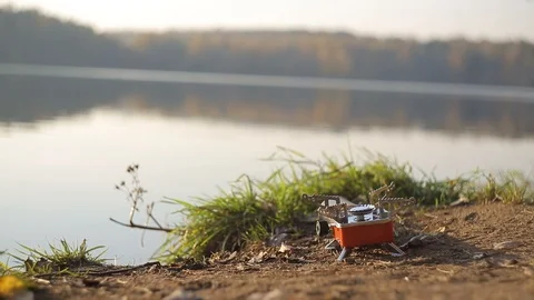 Cooking by the lake Stock Footage 99885586