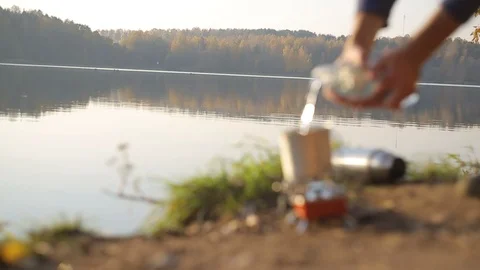 Cooking by the lake Stock Footage 99886037