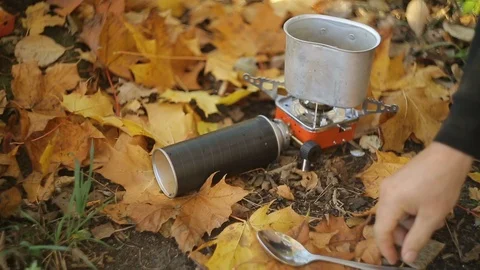 Cooking by the lake Stock Footage 99886559