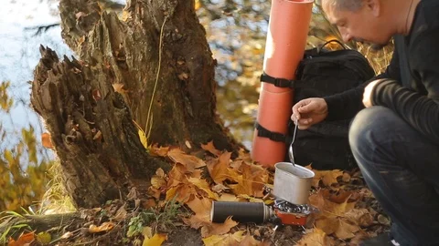 Cooking by the lake Stock Footage 99886862
