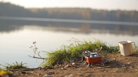 Cooking by the lake Stock Footage 103489393