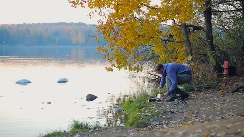 Cooking by the lake Stock Footage 106327299