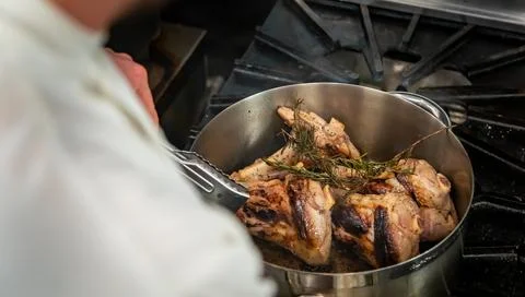 Cooking Lamb in Pot Stock Photos