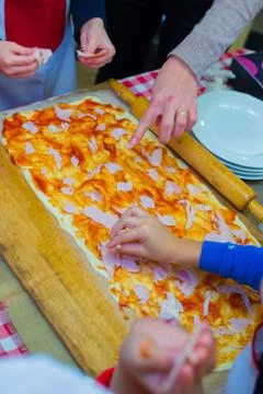Cooking a large rectangular pizza Stock Photos
