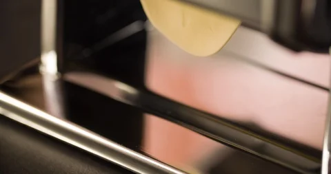 Cooking Lasagna dough in pasta machine closeup 4K Stock Footage 104047615