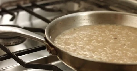Cooking leeks and parmesan risotto video Stock Footage 80304175