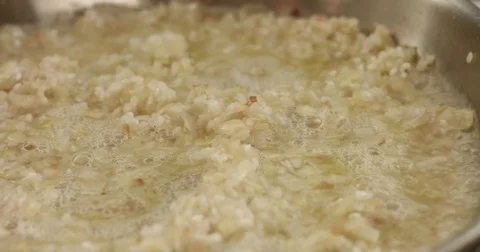 Cooking leeks and parmesan risotto video Stock Footage 80304418