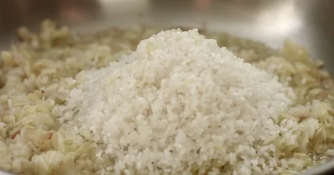 Cooking leeks and parmesan risotto video Stock Footage 80304657