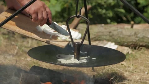 Cooking lunch on a campfire during a hike Stock Footage 144683198