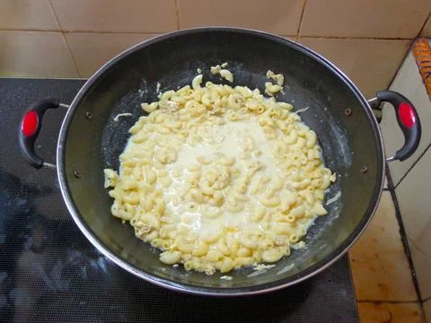 Cooking macaroni in a pan Stock Photos