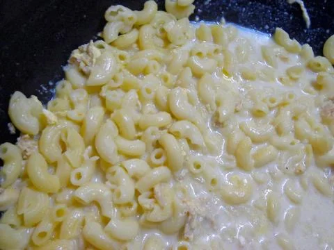 Cooking macaroni in a pan Stock Photos
