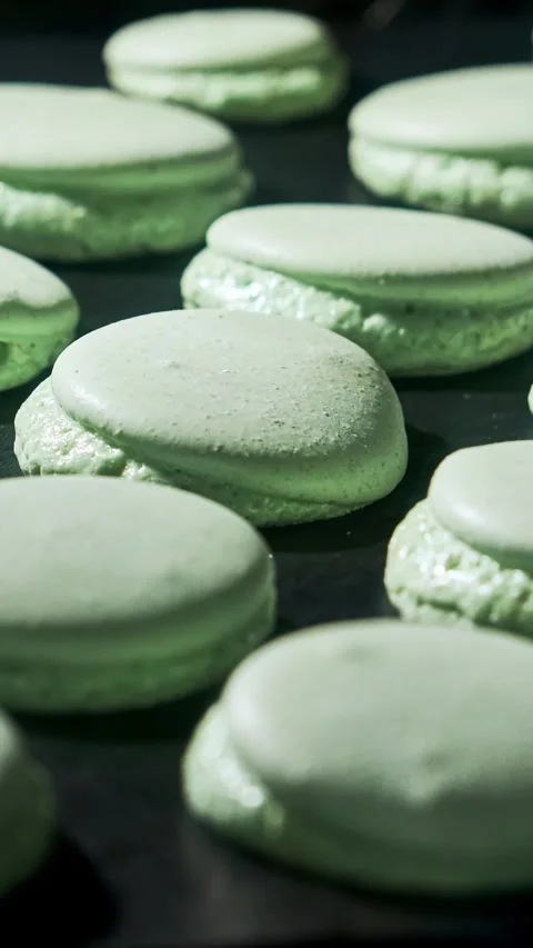 Cooking macarons. Baking macarons in electric oven. Vertical video. Slider dolly 스톡 동영상 302743506