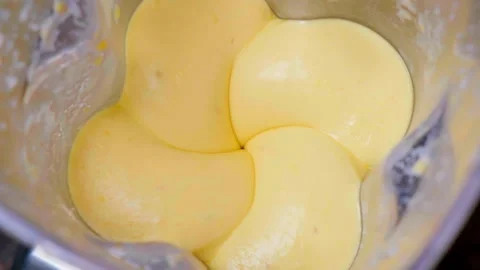 Cooking mango smoothie in blender. Stock Footage 150025007