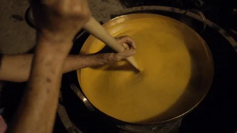 Cooking Mango Soup Paste in Old Way Stock Footage 122431525