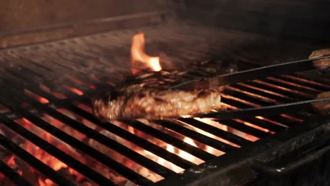 Cooking marble steak on fire. The finished dish is very juicy. Stock Footage 169700045