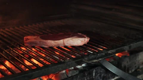 Cooking marble steak on fire. Stock Footage 169699326