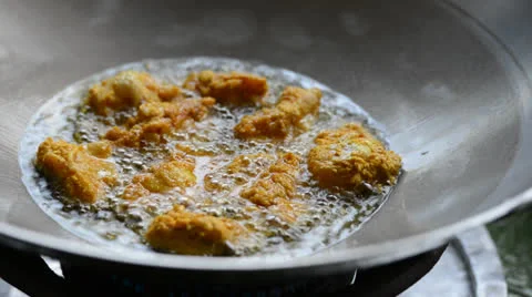 Cooking marinated curry chicken Stock Footage 26555088