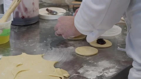 Cooking marmalade filled donuts Stock Footage 307339966