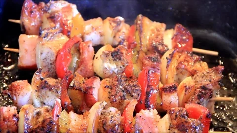 Cooking meat and vegetables in a pan, shashlik kebabs Stock Footage