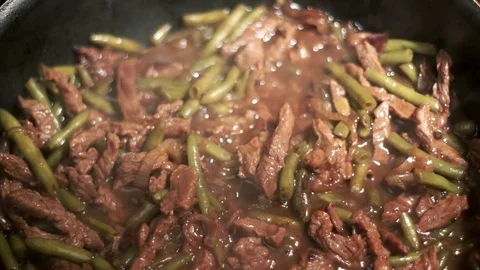 Cooking meat beef in frying pan. Stew meat. Preparation food Stock Footage 75055133