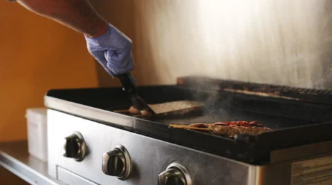 Cooking meat in a grill 库存影片 64238451