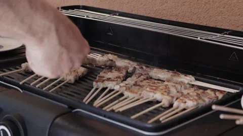 Cooking meat on grill Video stock 161061687