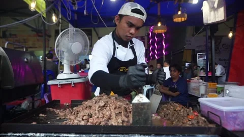 Cooking meat on a grill Stock Footage 276587022