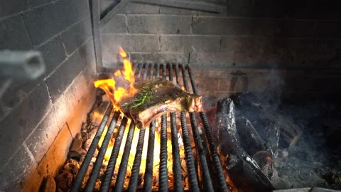 Cooking meat on the grill. Fresh beef steak. Stock Footage 147052332