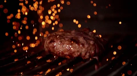 Cooking meat on the grill in slow motion Stock Footage