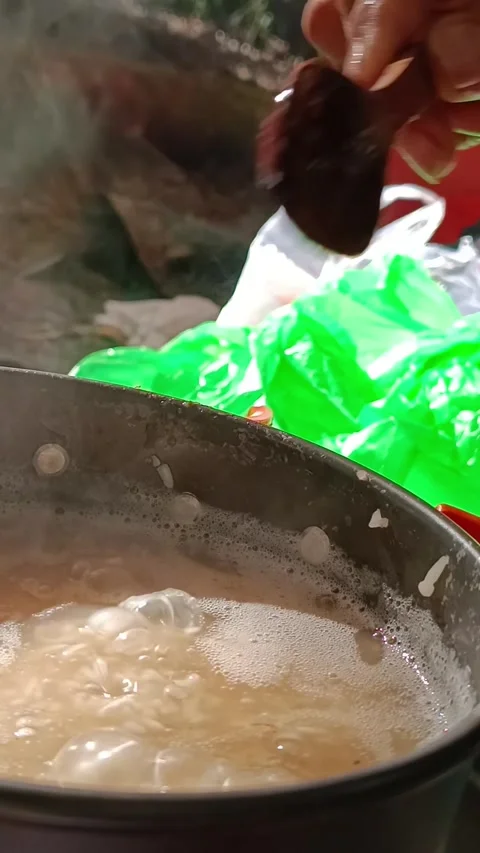 Cooking meat in the jungle Stock Footage 246778315