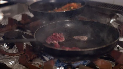 Cooking meat in a pan Stock Footage 86467986