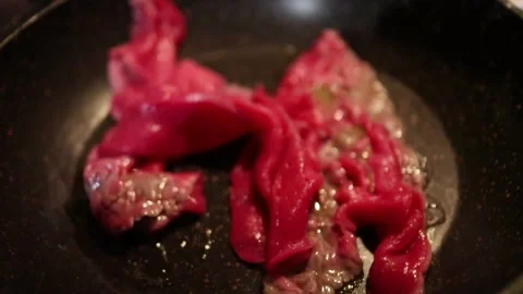 Cooking meat in pan fried Stock Footage 304487166