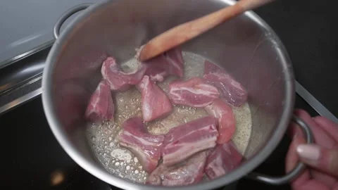 Cooking Meat in Saucepan for Authentic Home Meal 스톡 동영상 335426027