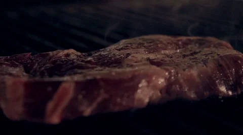 Cooking meat in slow motion Stock Footage 67860899