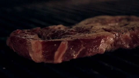 Cooking meat in slow motion Stock Footage 67860924