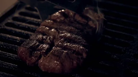 Cooking meat in slow motion Stock Footage 67863189