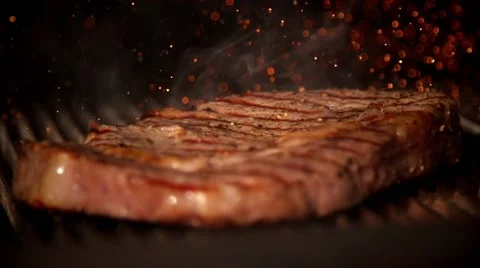 Cooking meat in slow motion Stock Footage 67866615