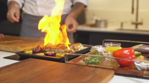 Cooking Meat Steak With Vegetables At Kitchen On Grill. Chef Preparing Food 스톡 동영상 142817930