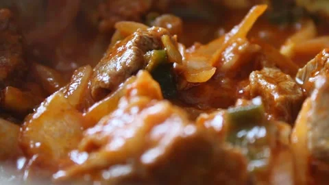 Cooking meat stew  with vegetables, close up view Stock Footage 134452017