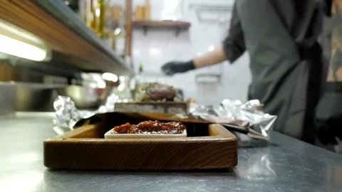 Cooking Meat on a Stone Stock Footage 132106562