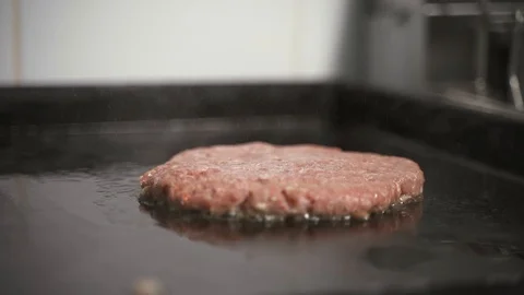 Cooking meat on the stove Stock Footage 129685197