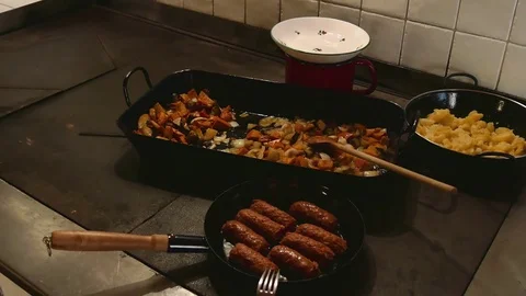 Cooking meat, vegetables and potatoes on old vintage stove hot plate Video stock 70090141