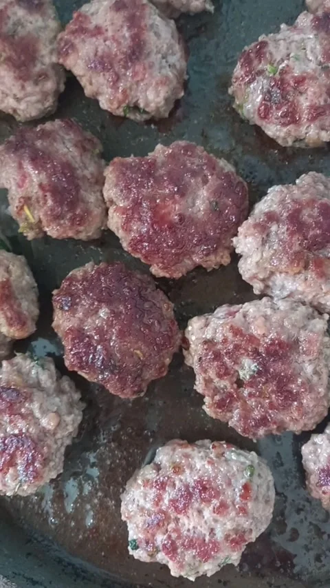 Cooking meatballs on a grill Stock Footage 274830559